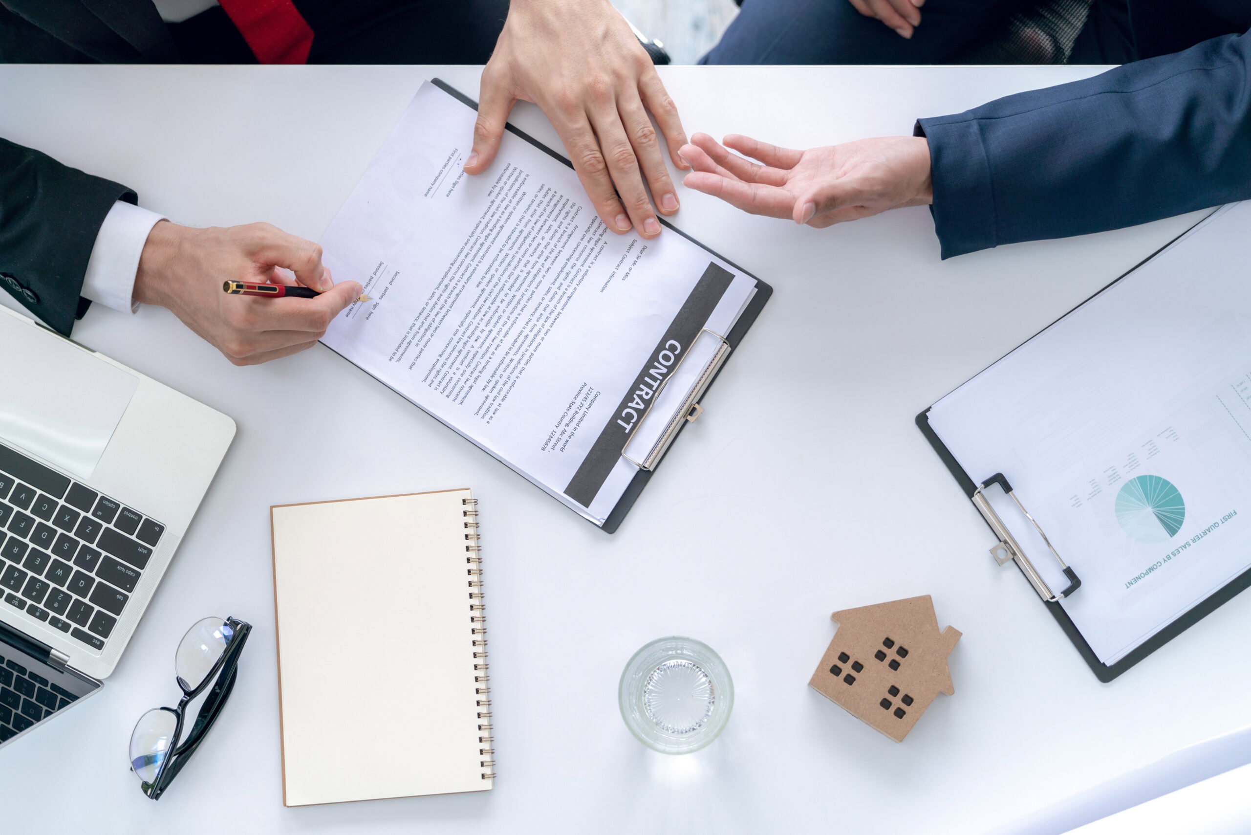 Businessman and home buyer customer had agree deal and signed in the contract sale of real estate